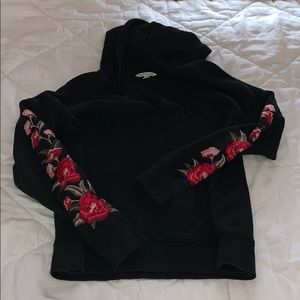 v-neck sweatshirt with flowers on the sleeves
